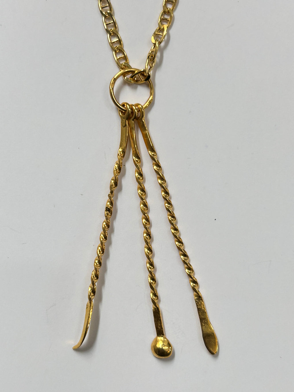 Pendentif cure-dent