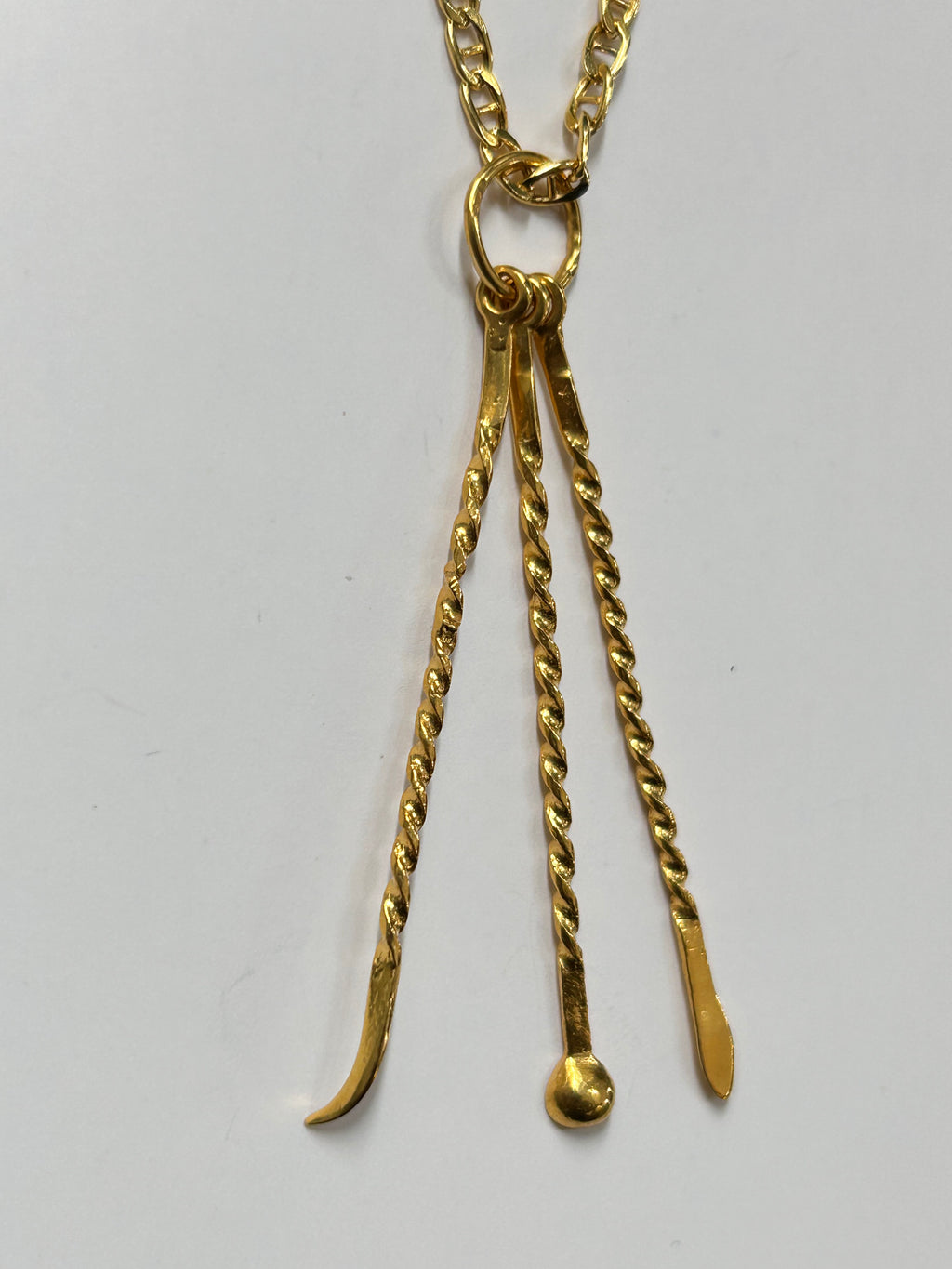 Pendentif cure-dent